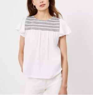 Loft flowt top with black stitched trim
